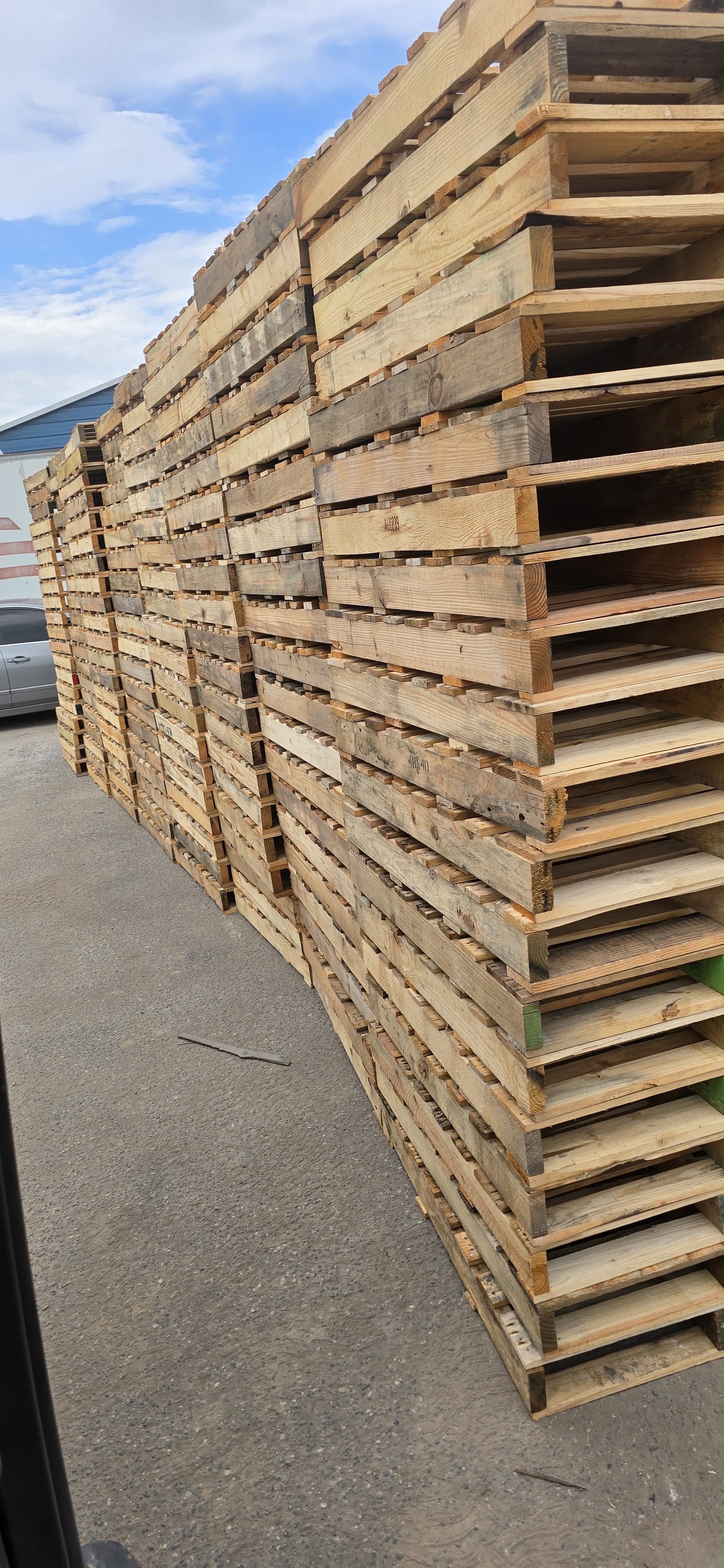 Stacked pallets at outdoor storage area